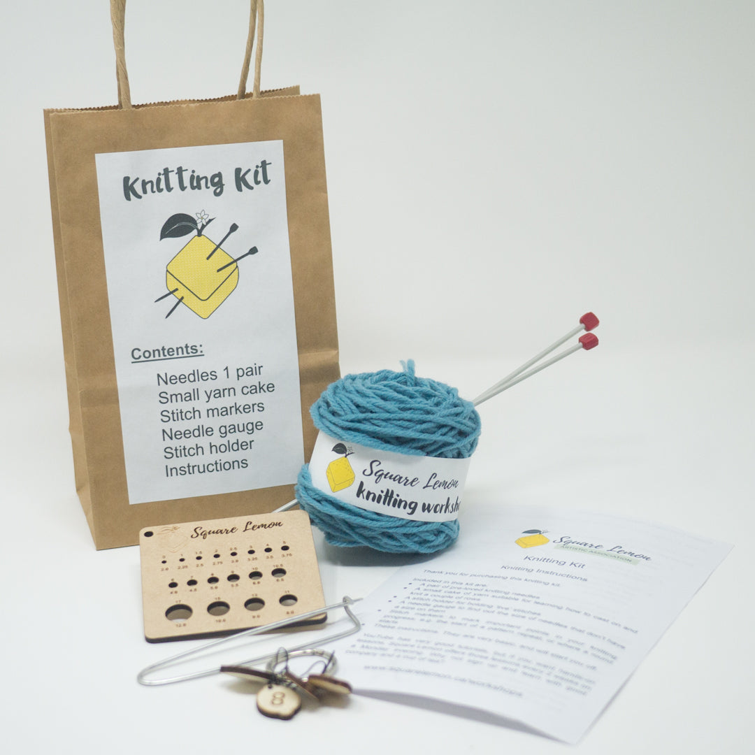 Knitting Kit, preloved knitting needles, cake of yarn, needle gauge, stitch markers, instructions, stitch holder