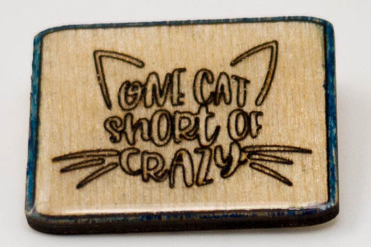 Laser-Engraved, Resin-Coated One Cat Short of Crazy Badge